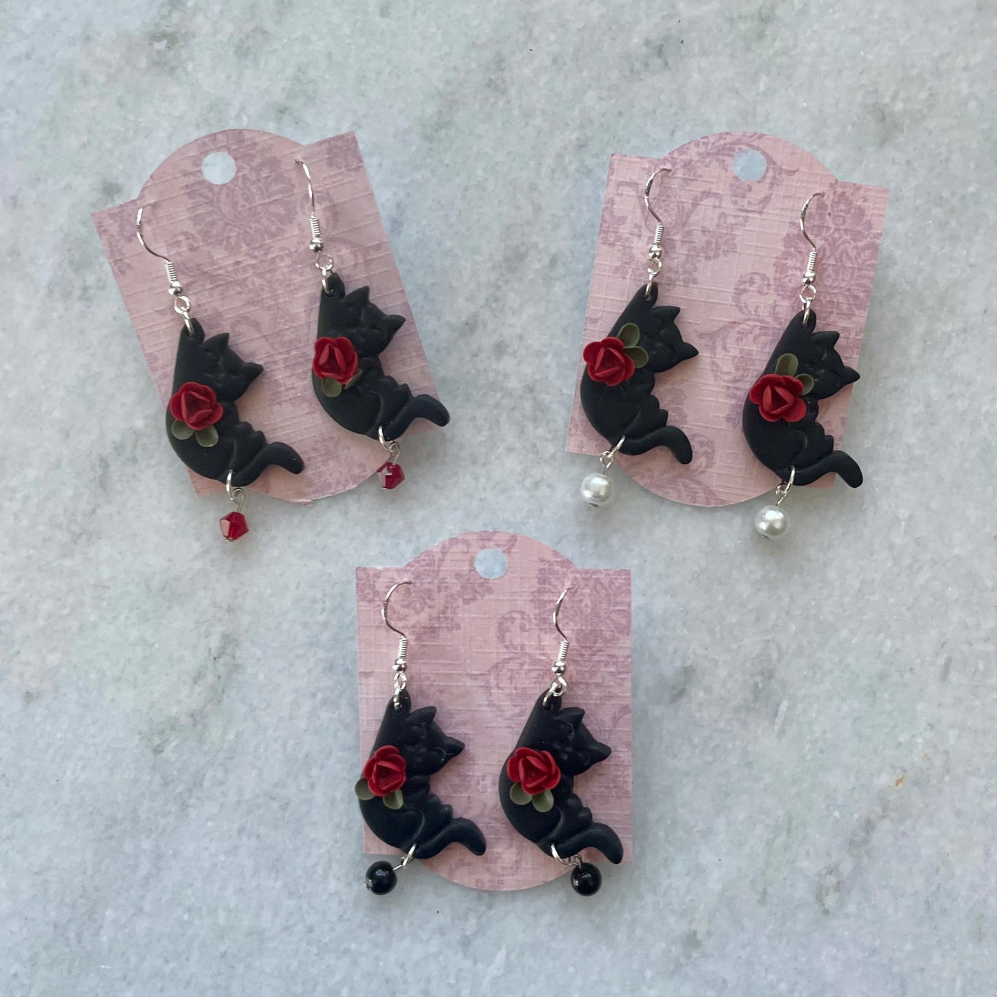 Black Hanging Cats