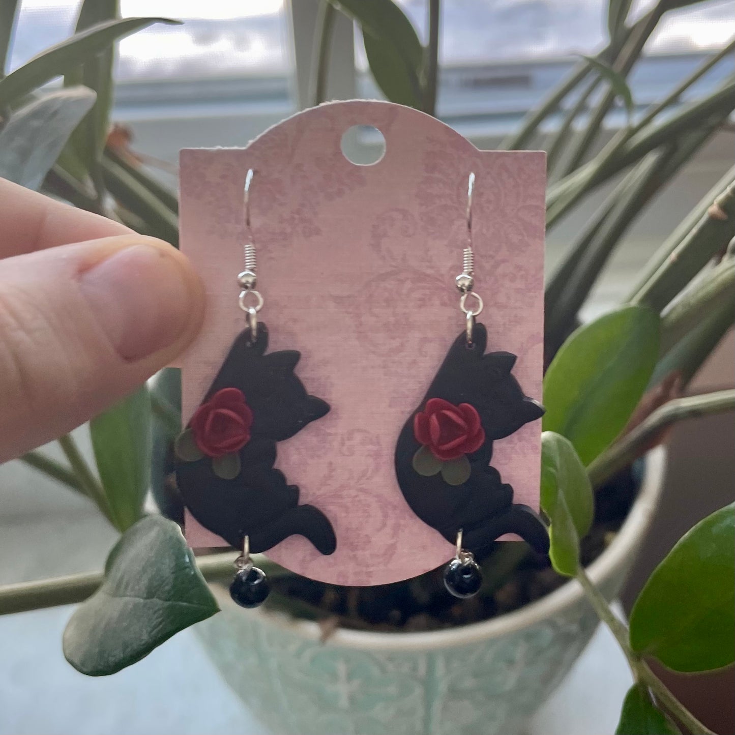 Black Hanging Cats