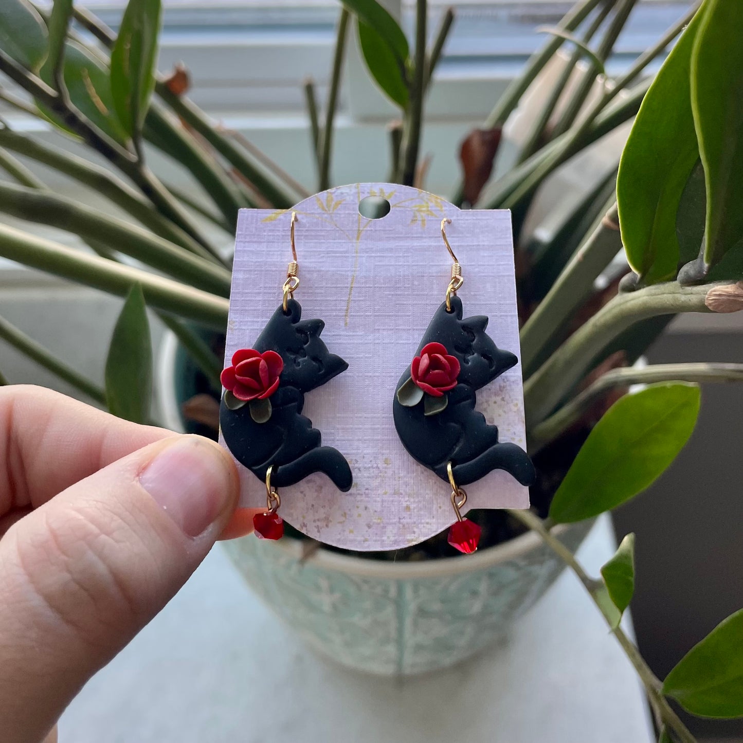 Black Hanging Cats