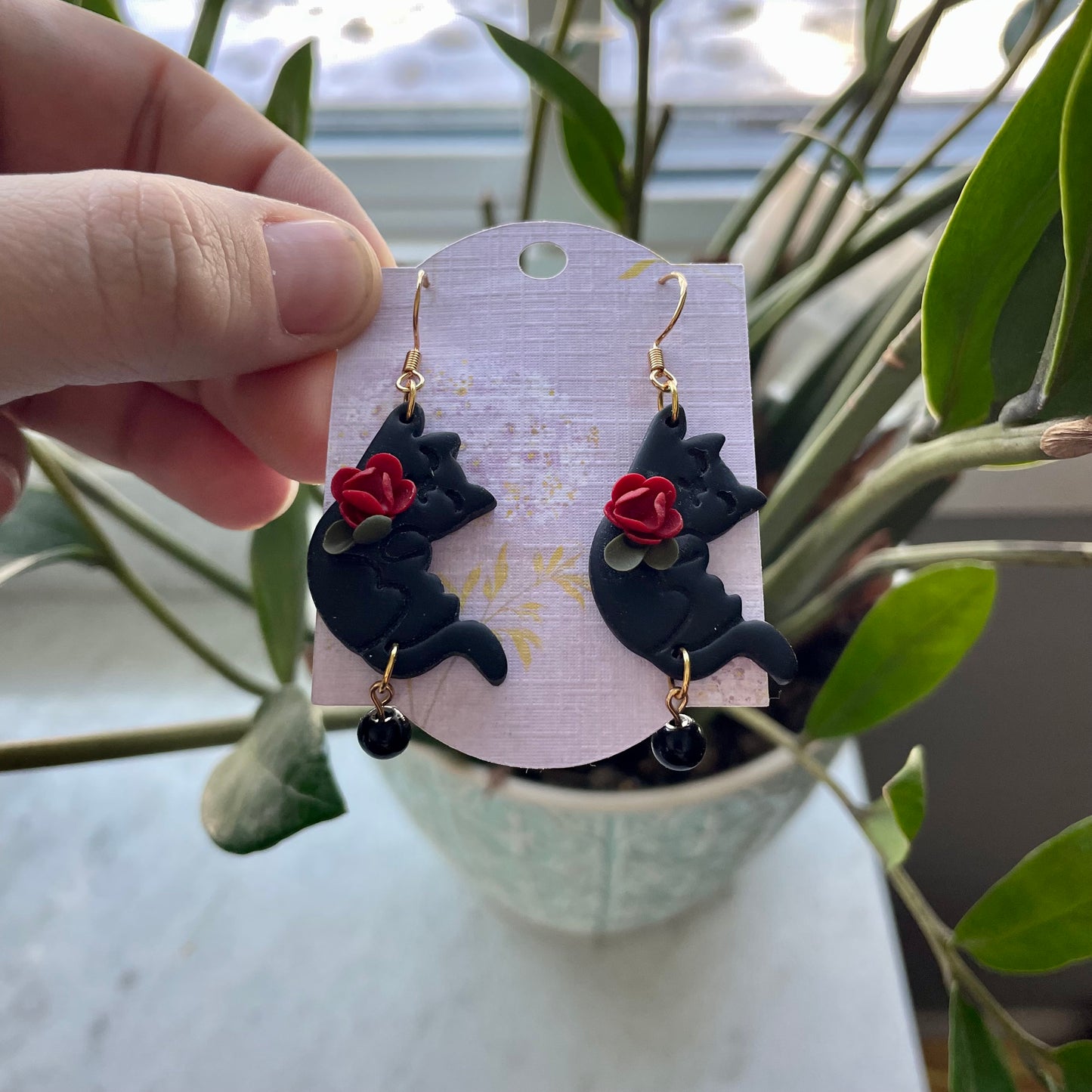 Black Hanging Cats