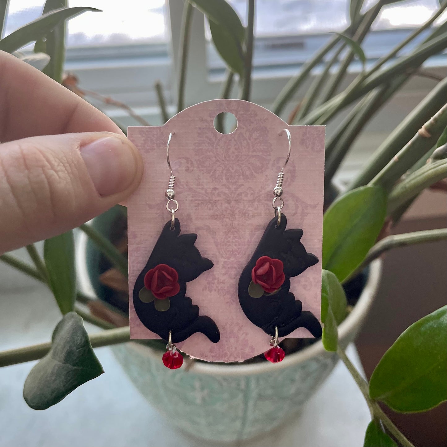 Black Hanging Cats